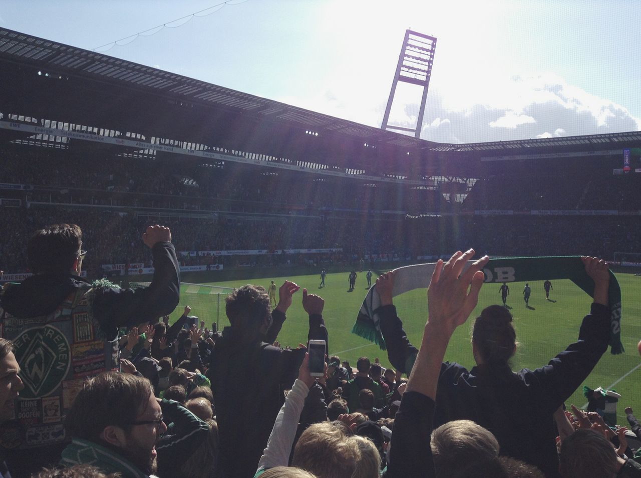 Cheering up the team. Ā· Bremen germany Weserstadion Werder Bremen Werder fans SUPPORT half time Stadium football stadium Fussball Football Real Football soccer Atmosphere euphoria against the sun