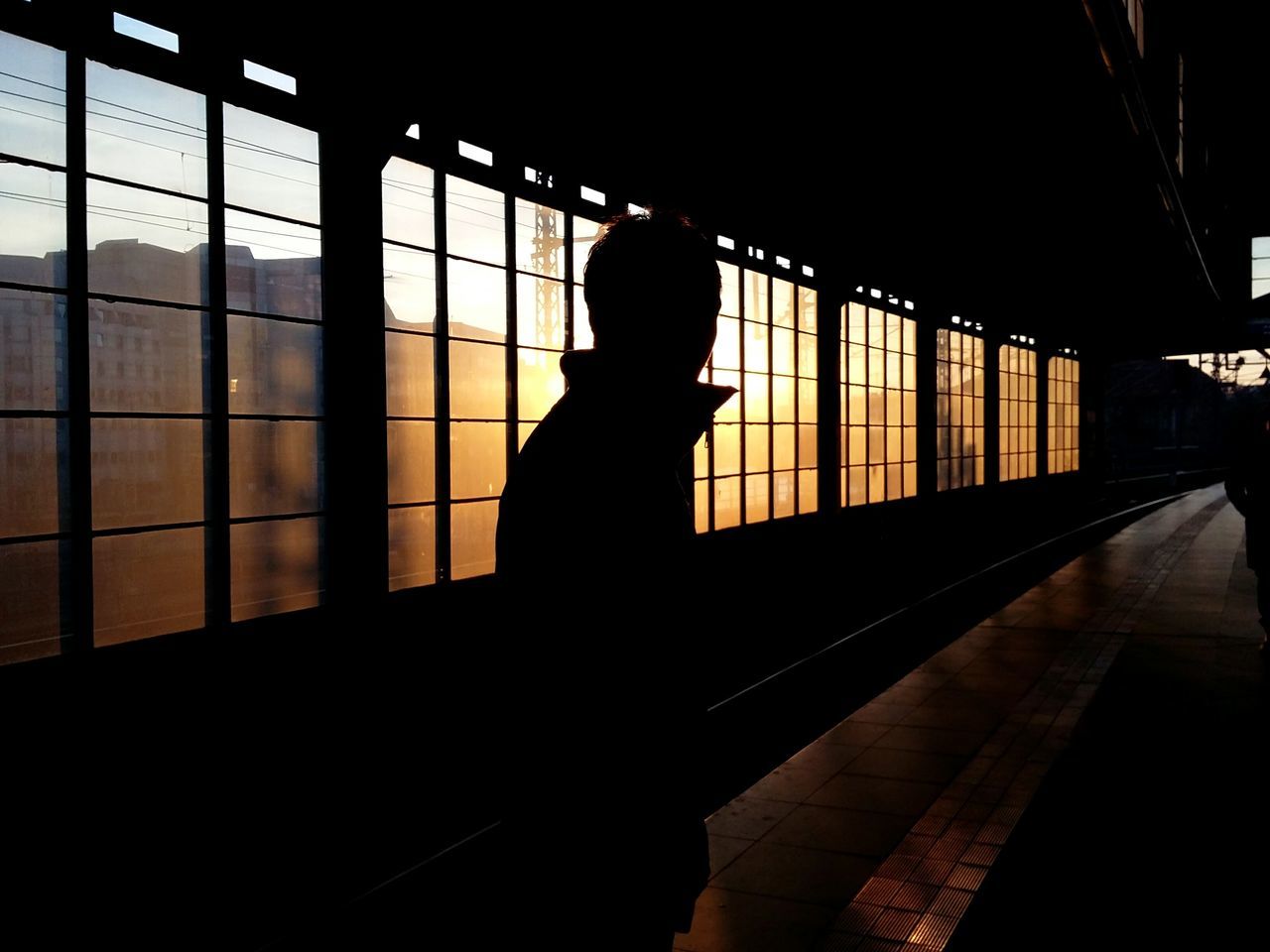 friend in the sunset. Ā· Berlin germany 030 metro station train station Against the light light and shadow Silhouette Silhouettes darkness and light Architecture Metal beams simplicity Urban geometry